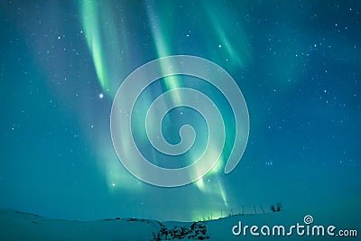 Aurora borealis over Sweden snowy mountain Stock Photo