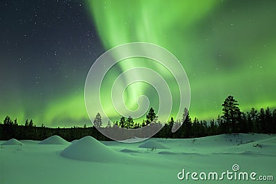 Aurora borealis over winter landscape, Finnish Lapland Stock Photo