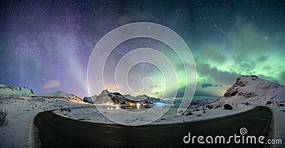 Aurora borealis with starry over mountain range on arctic coastline Stock Photo