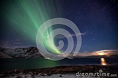 Aurora Borealis in Tromso, Norway in front of Norwegian fjord at winter Stock Photo