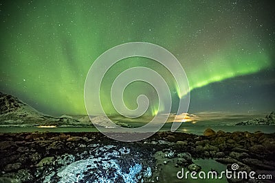 Aurora Borealis in Tromso, Norway in front of Norwegian fjord at winter Stock Photo