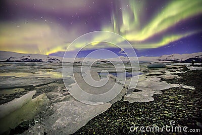 Auroral over the glacier lagoon Jokulsarlon in Iceland. Stock Photo