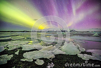 Auroral over the glacier lagoon Jokulsarlon in Iceland. Stock Photo