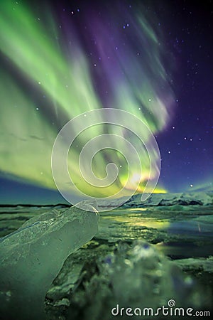 Auroral over the glacier lagoon Jokulsarlon in Iceland. Stock Photo