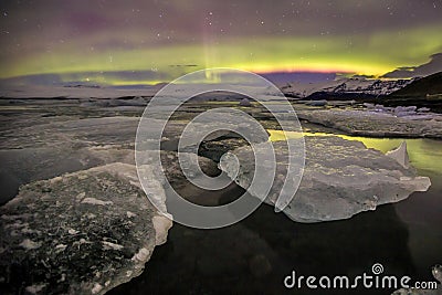Auroral over the glacier lagoon Jokulsarlon in Iceland. Stock Photo