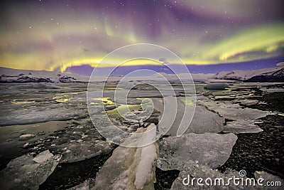Auroral over the glacier lagoon Jokulsarlon in Iceland. Stock Photo
