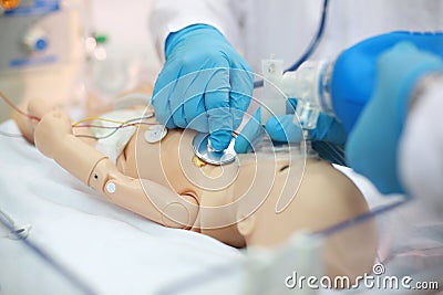 Newborn resuscitation. Endotracheal intubation. Practicing medical skills on a medical dummy. Medical education. Modern technologi Stock Photo