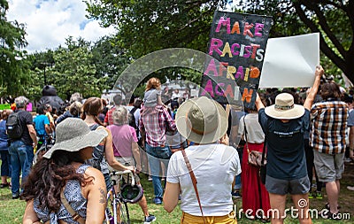 AUSTIN, TEXAS - JULY 2, 2019 - People protesting against President Donald Trump and border camps. Different demands written on Editorial Stock Photo