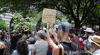 AUSTIN, TEXAS - JULY 2, 2019 - People protesting against President Donald Trump and border camps. Different demands written on Editorial Stock Photo