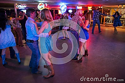 People dancing country music in the Broken Spoke dance hall in Austin, Texas Editorial Stock Photo