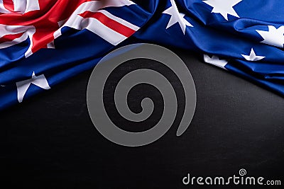 Australia day concept. Australian flag with the text Happy Australia day against a blackboard background. 26 January Stock Photo