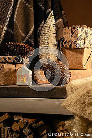 Australian bunya pine cone, warm blanket and gifts in a small forest house Stock Photo