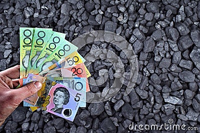 Australian currency showed on coal of mine deposit mineral resources background Editorial Stock Photo