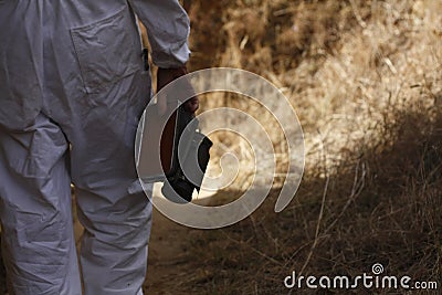 Australian farmer tending his bee hives Stock Photo