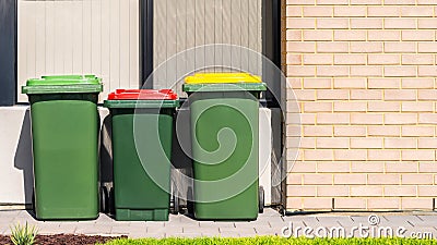 Australian home wheelie bins set on front yard Stock Photo