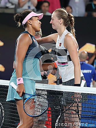 2019 Australian Open Champion Naomi Osaka of Japan embraces Petra Kvitova at the net following her win in the final match Editorial Stock Photo