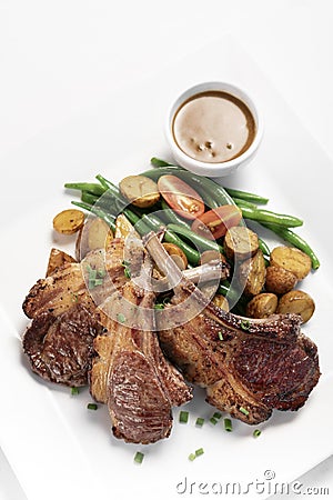 Australian organic lamb chops with gravy meal on white backgroundv Stock Photo