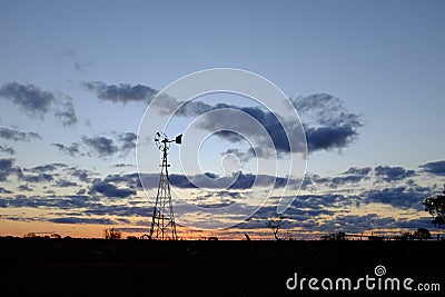 Australian sunrise Windmill silhouette Stock Photo