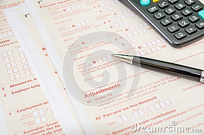 Australian tax forms with pen and calculator. Financial document. Tax time. Editorial Stock Photo