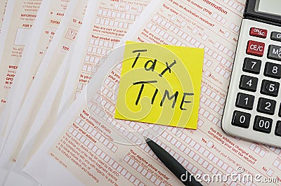 Australian tax forms on a table with a calculator and pen. Tax concept. `tax time` on the sticker. Editorial Stock Photo