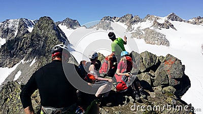 Austria. Alpine region `Stubai`. A group of climbers on top of the `Rinnenspitze` 3000 m. Editorial Stock Photo