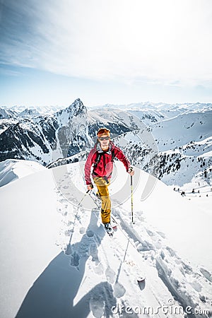 Austria, December 26 2018. Ski touring man in high alpine landscape with snowy trees Editorial Stock Photo