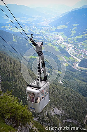 AUSTRIA - JULY 2014: people move by cable car to the Eisriesenwelt cave in July 24, 2014, located in Werfen, Austria Editorial Stock Photo