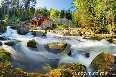 Austria panorama landscape with waterfall and watermill near Sal Stock Photo