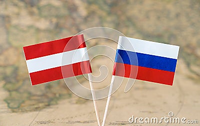 Austria and Russia flag pins on a world map, political or diplomatic relations concept Stock Photo