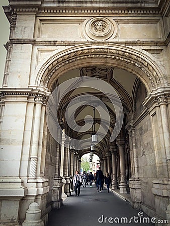 People pass under the arches Editorial Stock Photo