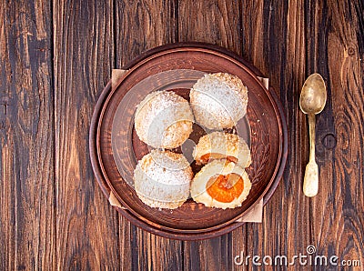 Austrian and czech sweet dessert knedle apricot dumplings on gray concrete background. Filled cottage cheese dough. top view Stock Photo