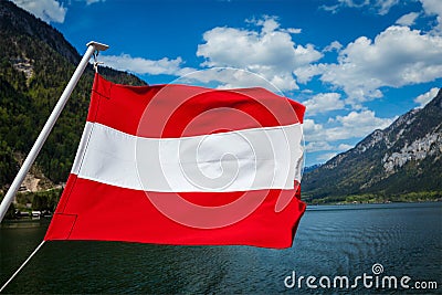 Austrian flag against mountain lake Stock Photo