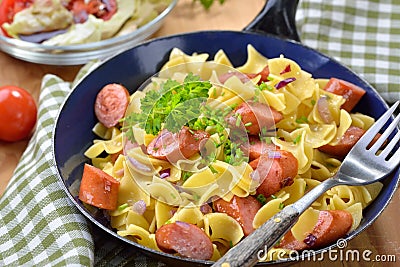 Austrian pasta dish with sausages Stock Photo
