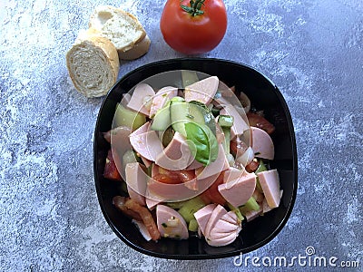 Austrian sausage salad `Wurstsalat` is a traditional snack and a light summer dish Stock Photo