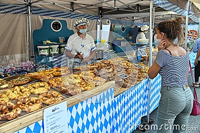Authentic german handmade bretzel bakery at street food fair Editorial Stock Photo