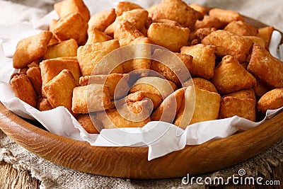 Authentic recipe West African snack Chin Chin closeup in a bowl. Stock Photo