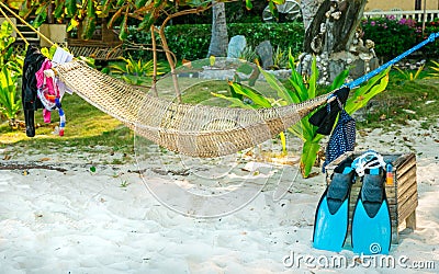 Authentic view of snorkeling equipment drying near a traditional Stock Photo
