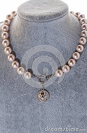 author beautiful pearls necklaces demonstrated on maneken. fashion and jewelry concept Stock Photo