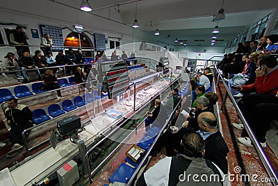 Authorized buyers bidding for captures on a fish market Editorial Stock Photo