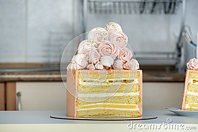 Authors cake made of sponge cakes with vanilla and fruit filling. Marshmallow cake decor Stock Photo