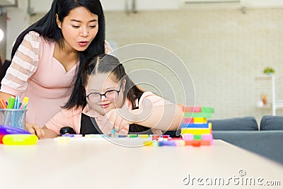 Autism girl with learning practice at home Stock Photo