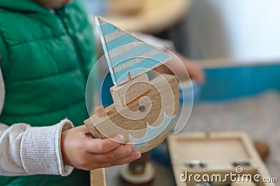 Autistic kid play alone with train toys Stock Photo