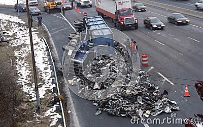 Auto accident truck overturned spilling its contents Editorial Stock Photo