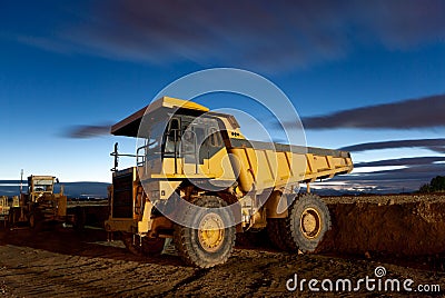 Auto-dump yellow mining truck night excavator Stock Photo