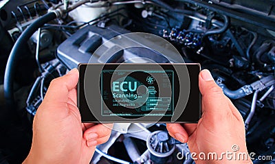 Auto mechanic checking ECU engine system with OBD2 wireless scanning tool and car information showing on screen interface Stock Photo