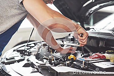 Auto mechanic working in garage. Repair service Stock Photo