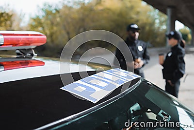 Auto with police lettering near multicultural Stock Photo