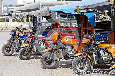 Auto rickshaw, three wheels motorcycle taxi on the street in Myanmar. This transport is cheap and popular in Burma. Editorial Stock Photo