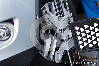 Auto wheel fixed in alignment machine clap Stock Photo