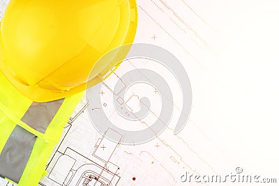 Autocad drawing, Architecture and construction, builder`s hard hat and safety vest on architectural blueprints Stock Photo
